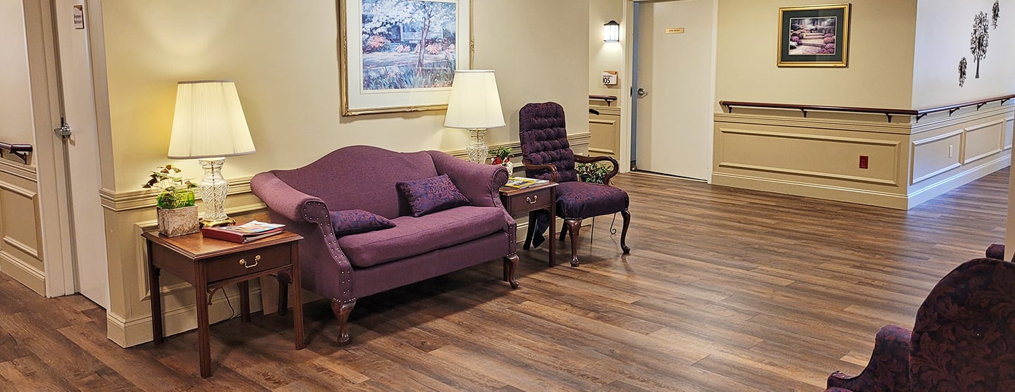 A sitting room with a couch and chairs