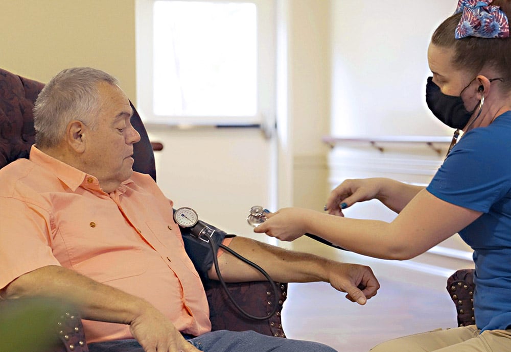 man getting blood pressure taken