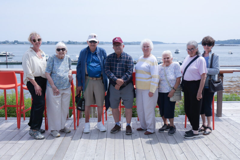 A group photo of Schooner Estate residents on an outing to Dolphin Marina